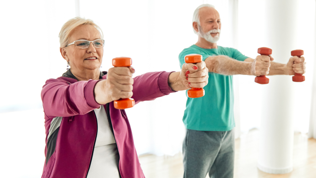 A healthy-looking couple lifts light weights together to improve their bone density post-chemo.