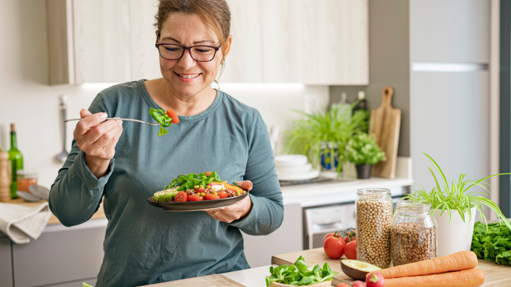 A health woman enjoys a nutritious meal as part of her bone density health.
