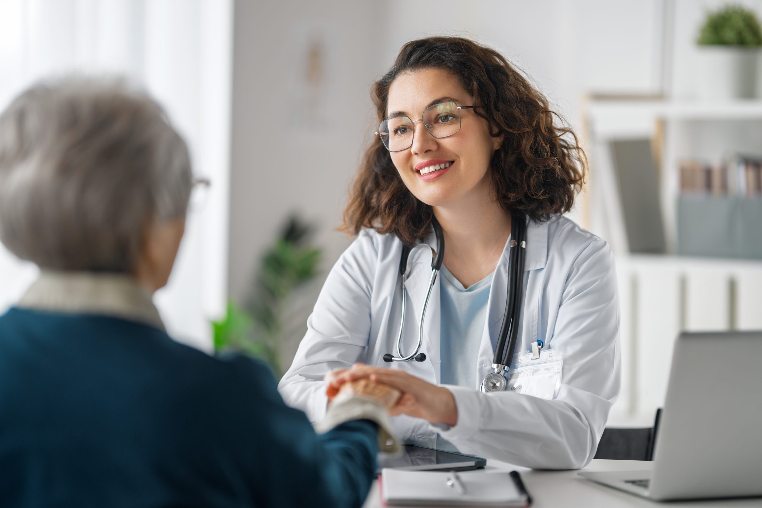 patient with a doctor in medical office